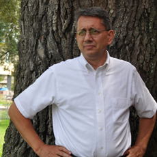 David Perkes by a tree.