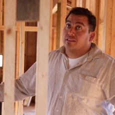 Mike framing a house.