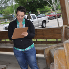 Sarah Grider examining a house.