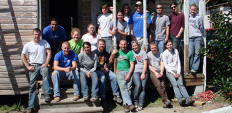 The group of volunteers smiles for the camera